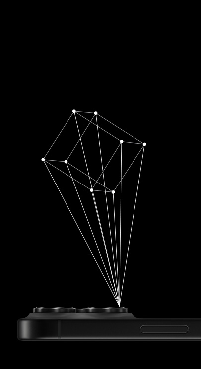 一部正面朝下的 iPhone，從 iPhone 的光學雷達掃描儀投射出 3D 立方體的輪廓 