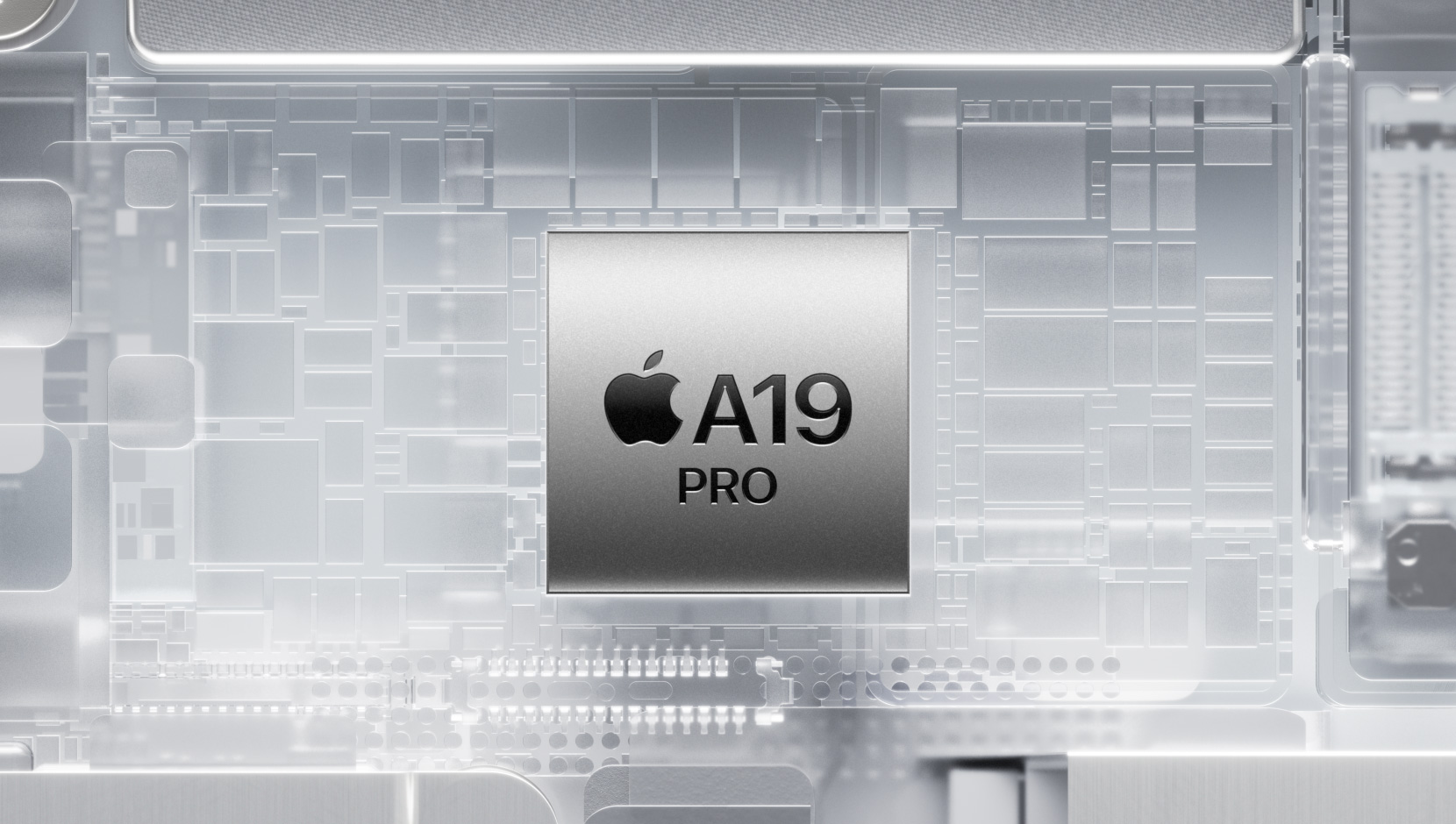 Un chip A19 Pro circondato dai componenti interni luminosi di un iPhone